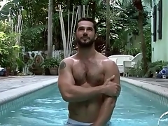 Hot lanose guy relating near the pool and shower